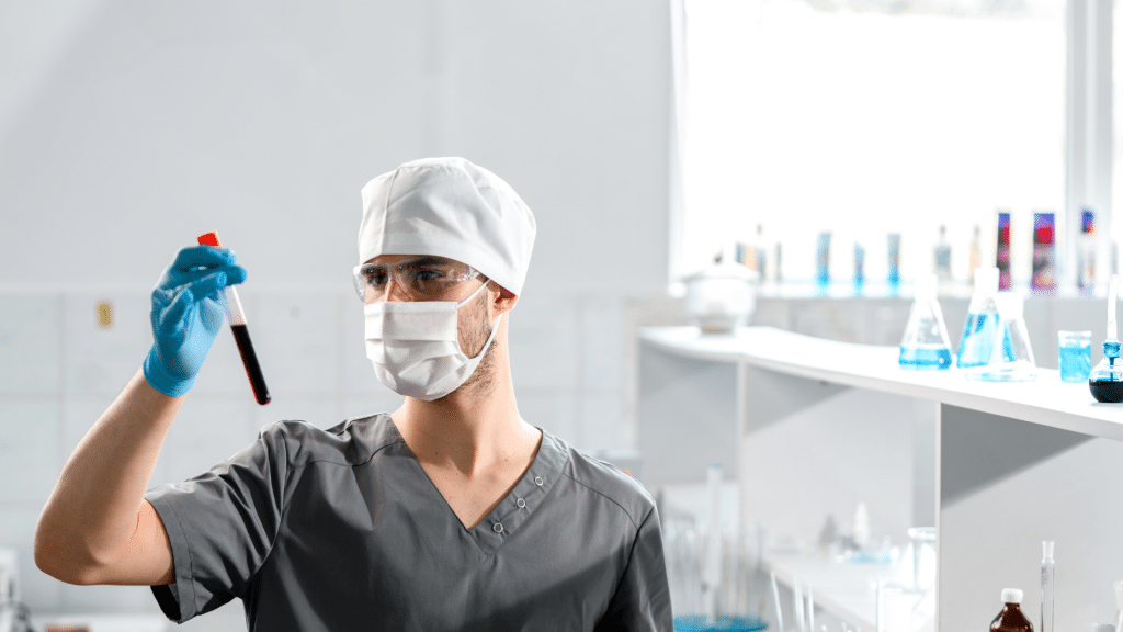 Healthcare professional in a lab setting examining a sample vial for drug test analysis